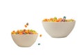 Colorful cereal box for morning breakfast. Corn flakes falling to the white bowl. Motion Royalty Free Stock Photo