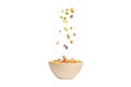 Colorful cereal box for morning breakfast. Corn flakes falling to the white bowl. Motion Royalty Free Stock Photo