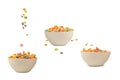 Colorful cereal box for morning breakfast. Corn flakes falling to the white bowl. Motion Royalty Free Stock Photo