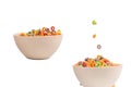 Colorful cereal box for morning breakfast. Corn flakes falling to the white bowl. Motion Royalty Free Stock Photo