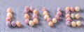 Colorful cereal corn balls mix, fruit flavor bowl sweets on gray cement background, close up, fresh, delicious and healthy