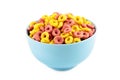 Colorful cereal loop rings on blue bowl isolated on white background. Breakfast food Royalty Free Stock Photo