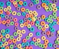 Colorful cereal on a purple background