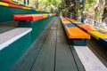Colorful chairs, green floor and empty chairs