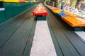 Colorful chairs, green floor and empty chairs