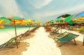 Colorful chairs and umbrella on tropical beach at Koh Khai Nok I Royalty Free Stock Photo