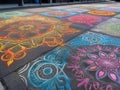 Colorful chalk art mandala on sidewalk