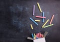 Colorful chalk on blackboard background. Royalty Free Stock Photo