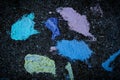 Fun colorful chalk crayons dissolved on the sidewalk Royalty Free Stock Photo