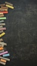 Colorful chalks arranged on blackboard, ideal for educational settings