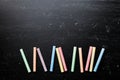 Colorful chalks on blackboard for back to school background. Royalty Free Stock Photo