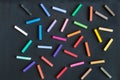 Colorful chalks seamless pattern on blackboard