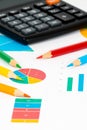 Colorful charts with pencils and calculator Royalty Free Stock Photo