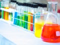 Colorful chemical substance in the clear test tube and flask