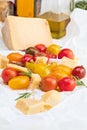 Colorful cherry tomatoes red, garnet and yellow, fresh and raw with sheep cheese. With drops of water and rosemary. Homemade and