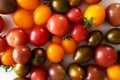 Colorful cherry tomatoes on white background. Close up. Selective focus. Royalty Free Stock Photo