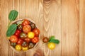 Colorful cherry tomatoes on wooden table Royalty Free Stock Photo
