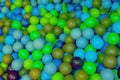 Colorful child balls. Multi-colored plastic balls. Achildren`s playroom. Background texture of multi-colored plastic balls on