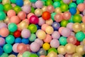 Colorful child balls. Multi-colored plastic balls. Achildren`s playroom. Background texture of multi-colored plastic balls on