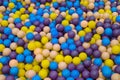 Colorful child balls. Multi-colored plastic balls. A children`s playroom. Background texture of multi-colored plastic balls on th