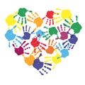 Colorful child hand prints in heart shape Royalty Free Stock Photo