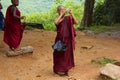 Colorful Child Monk Taking Photograph in Sri Lanka