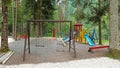 Colorful children's playground in the forest, Kamenica