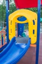 Colorful children's Playground with slides and swings outdoors in the Park in summer Royalty Free Stock Photo