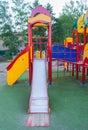 Colorful children's Playground with slides and swings outdoors in the Park in summer Royalty Free Stock Photo