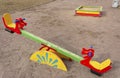 Colorful children`s swings on the playground in the courtyard of multi-storey buildings Royalty Free Stock Photo