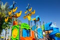 Colorful children sailboat-shaped playground activities in public park. Play areas with safe swings and slides. Modern arrangement Royalty Free Stock Photo