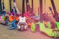 Colorful children scooters on city street