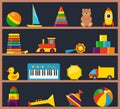 Colorful children toys on wooden shelves. Cubes, whirligig, duck, ball rattle, truck, pyramid, pipe, bear, ball, rocket,