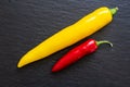 Colorful chili peppers isolated on a slate plate Royalty Free Stock Photo