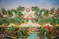 Colorful chinese dragon statues on roof in Chinese temple. Chine Royalty Free Stock Photo