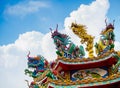 Colorful chinese dragon and swan sculpture on the rooftops of ch Royalty Free Stock Photo