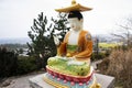 Colorful chinese god figure and deity angel buddha statue on stone stairs go to Sanbangsan mountain for korean people travelers Royalty Free Stock Photo