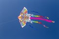 Colorful chinese kite flying in the blue sky with white clouds Royalty Free Stock Photo