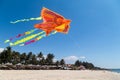 Colorful chinese kite flying in the blue sky with white clouds Royalty Free Stock Photo