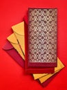 Colorful Chinese New Year envelopes with red background. Happy Chinese New Year concept.