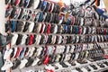 Colorful Chinese sneakers are hung in rows in the market. Sale of fashionable sneakers. Russia, Abakan 23.09.2019.