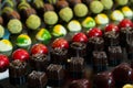 Colorful chocolate candies with different flavors. Exclusive delicious handmade sweets