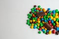 Colorful chocolate candies on the white background