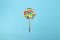 colorful chopped paper lollipop and brush, creative art modern design, blue background, beautiful view, minimal concept Royalty Free Stock Photo