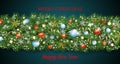 Colorful Christmas border decoration and happy New Year garland. Christmas tree branches with snow decorated red and blue baubles
