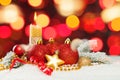 Colorful Christmas card with bokeh light, red ribbon, green fir branch, garland, baubles and white snow Royalty Free Stock Photo