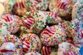 Colorful Christmas cookies made with peppermint kisses and rainbow sprinkles, selective focus