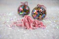 Colorful Christmas food photography picture with old fashioned candy cane sweets and bauble tree decorations in the background Royalty Free Stock Photo