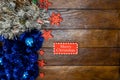 Colorful Christmas garlands. Christmas composition on wooden board with Christmas garland and decorations Royalty Free Stock Photo