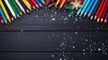 Colorful Christmas Pencils On Dark Wooden Surface With Snow Scenes Royalty Free Stock Photo